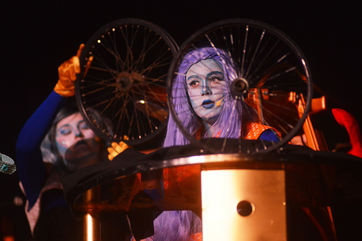 Fashionista alien Essie, played by Payton Redden, peers out